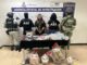 Detienen a mujer por posesión de drogas, armas de fuego, cartuchos y dinero